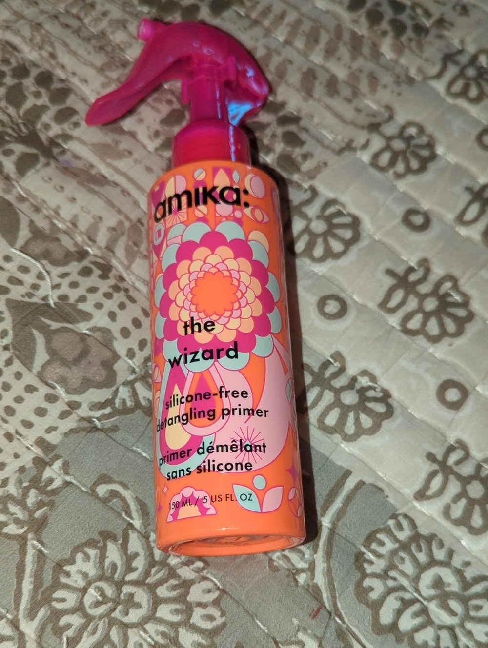 amika The Wizard Detangling Primer - Pink & Orange Bottle